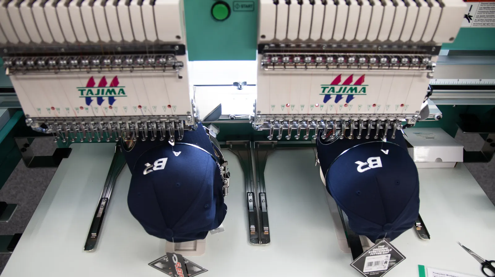 Caps being embroidered in-house at BR Apparel