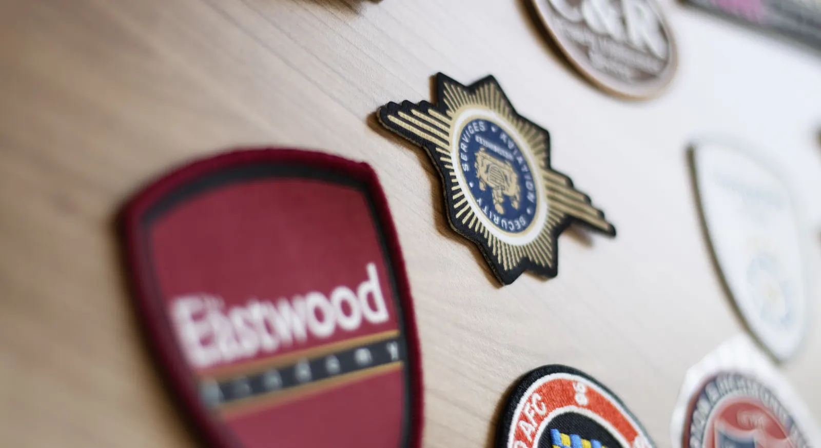 Close-up of an embroidered logo stitched onto a branded garment