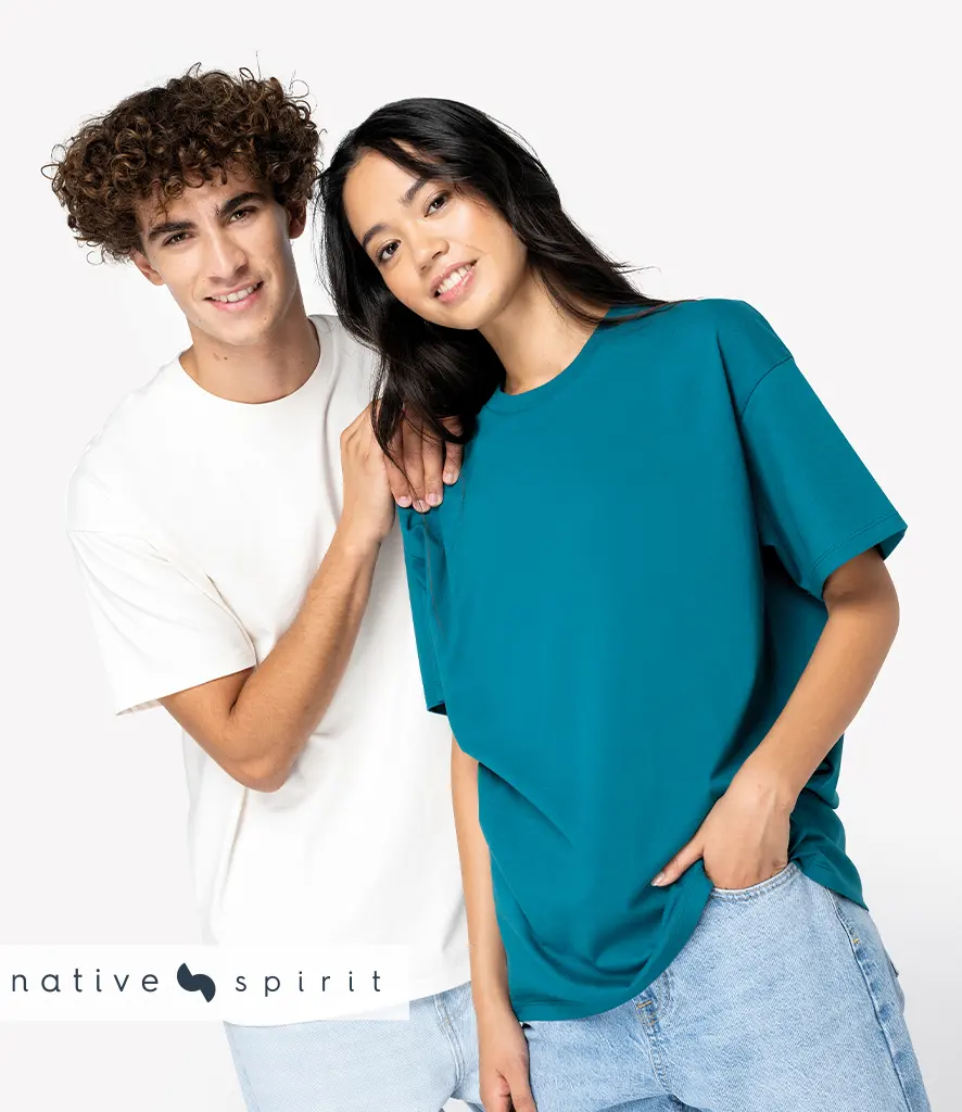 Two models wearing plain oversized t-shirts with dropped shoulders, one white and one teal