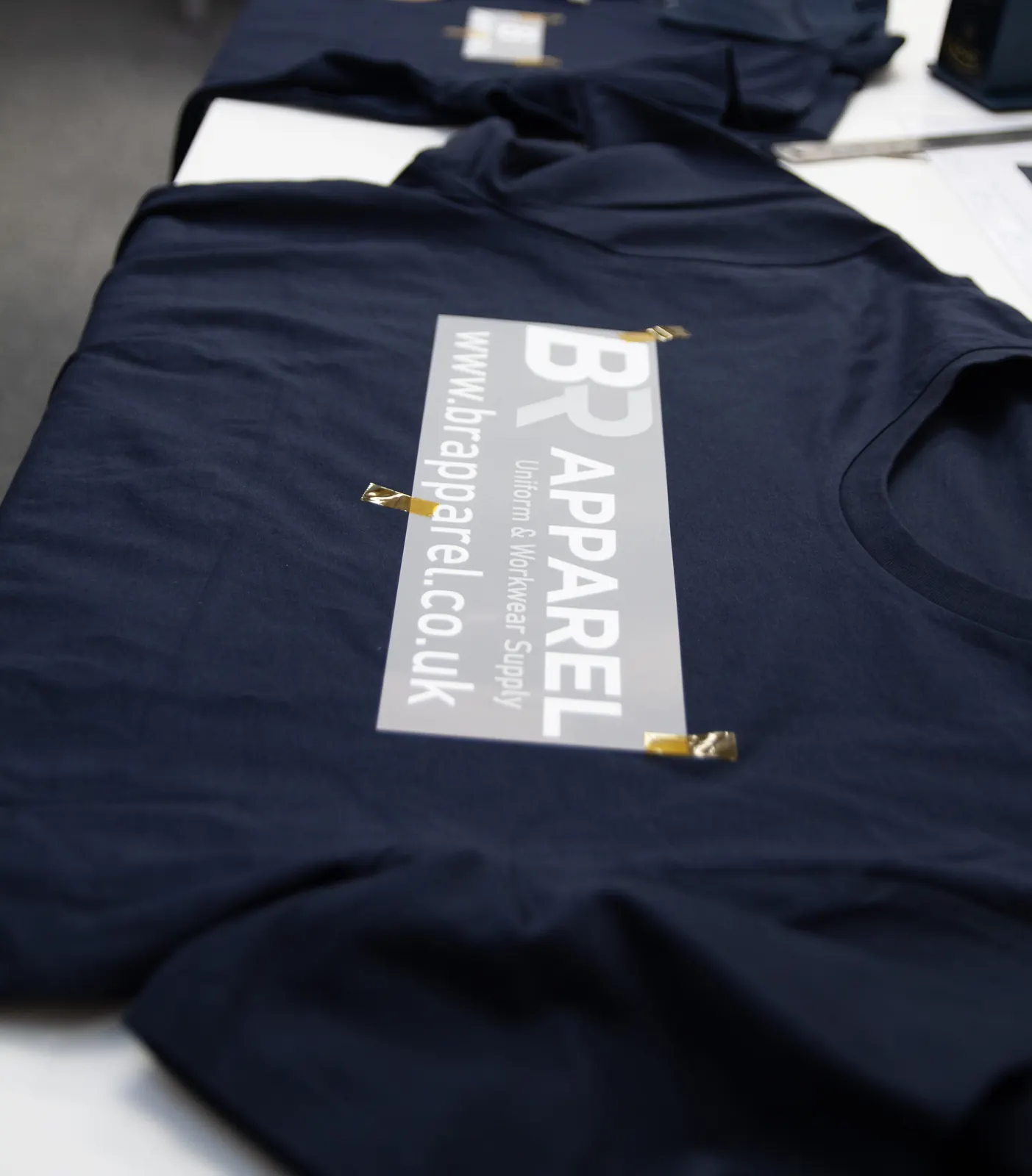 Branded navy polo finished at BR Apparel in Bradford for a Harrogate customer