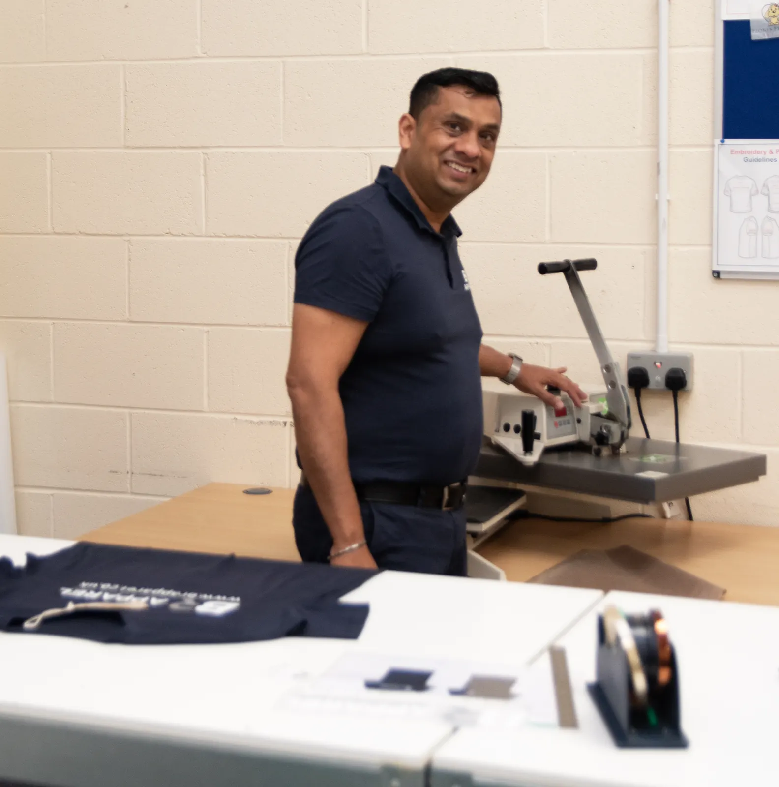 Bradford print production area with printed garments being finished