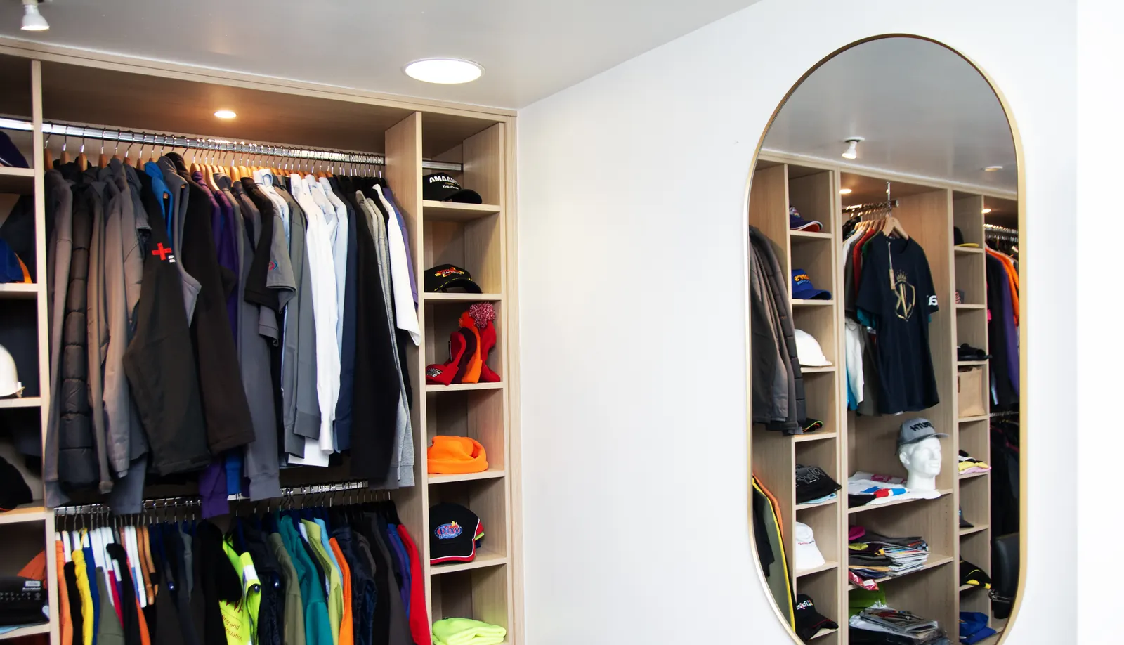 Workwear and uniform samples on the rails in the BR Apparel showroom